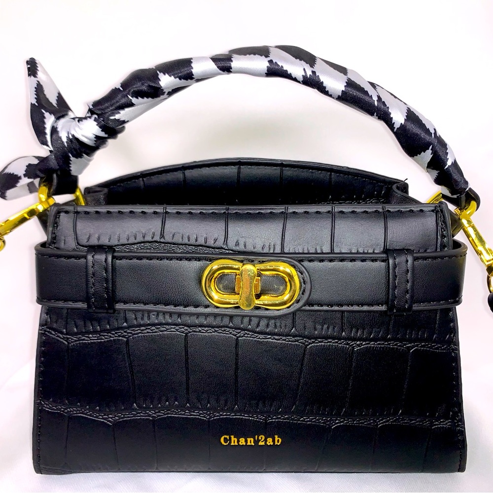 Classic black croc pattern handbag.